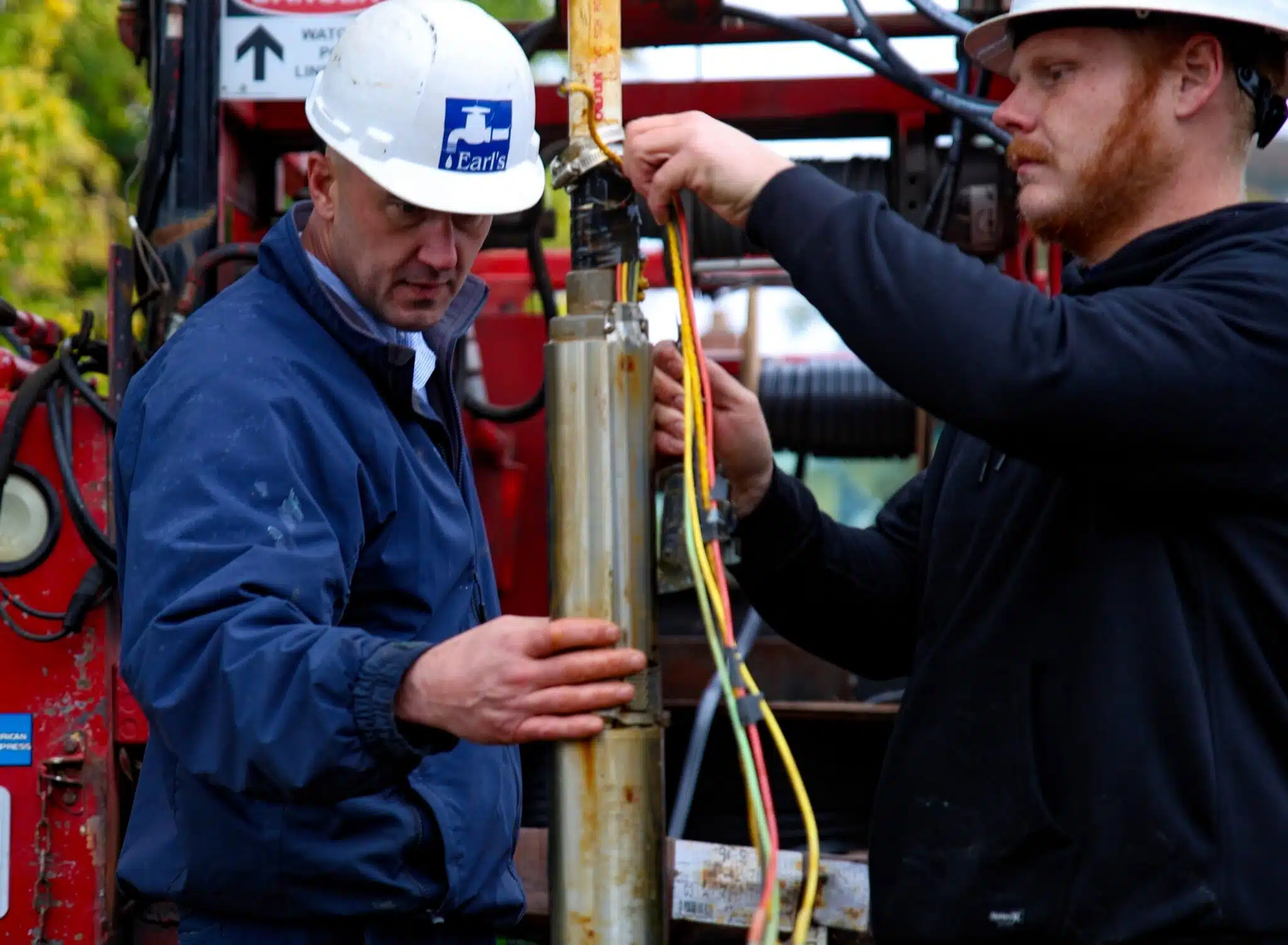Earl's Plumbing technician replacing a well pump on a Northern California property
