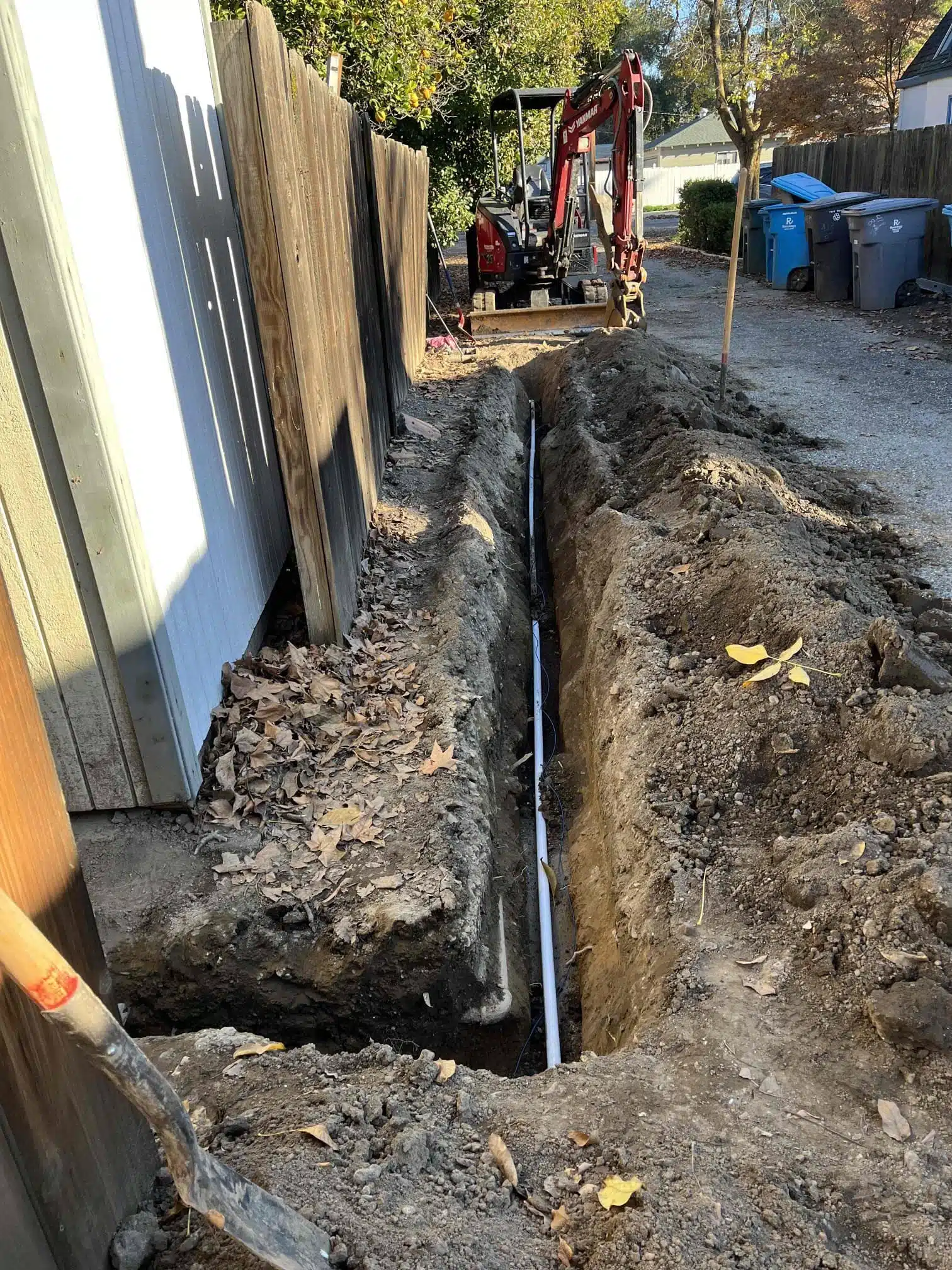 Main Water Line Replacement in Alley Main water line replacement in alley with trench and new pipe installed
