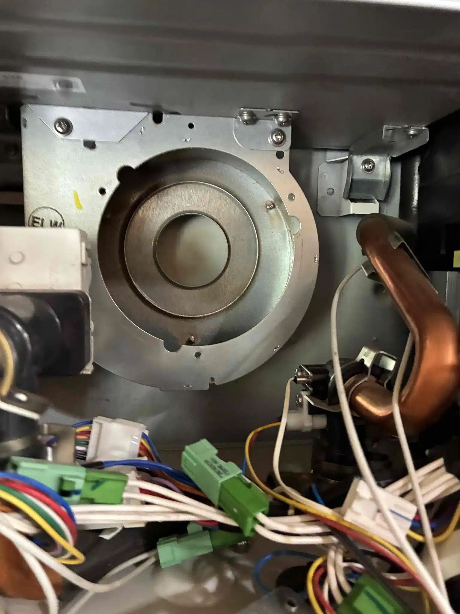 Tankless water heater blower fan removal during repair in Paradise CA