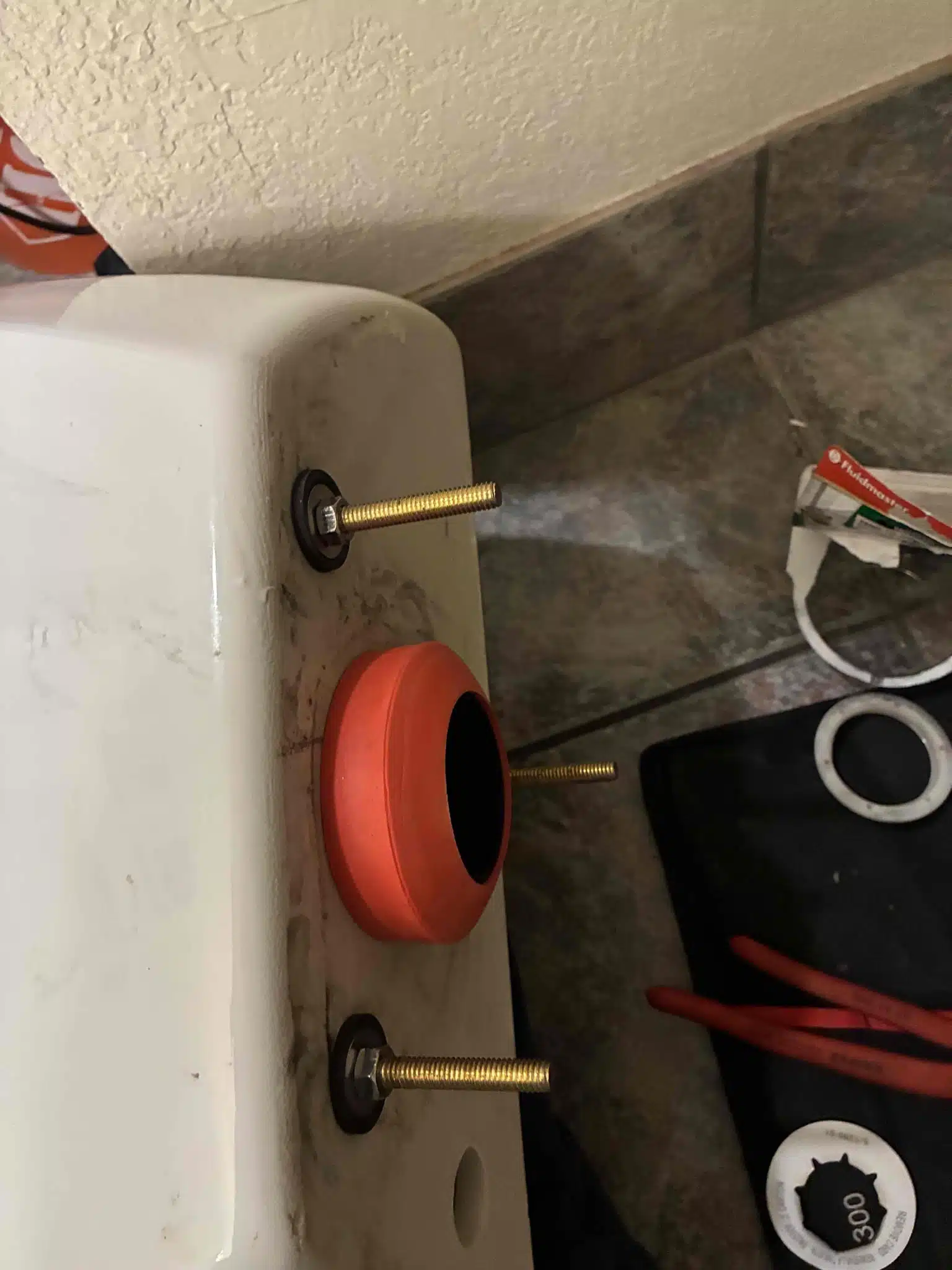 Replacing tank-to-bowl gasket during toilet repair by Earl's Plumbing